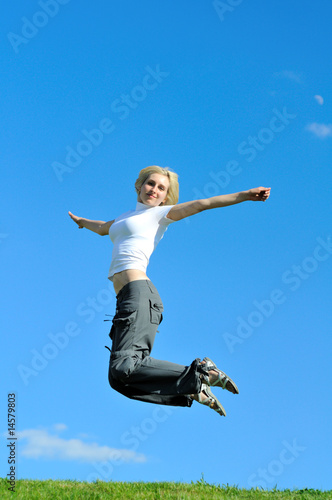 Pretty young woman is jumping