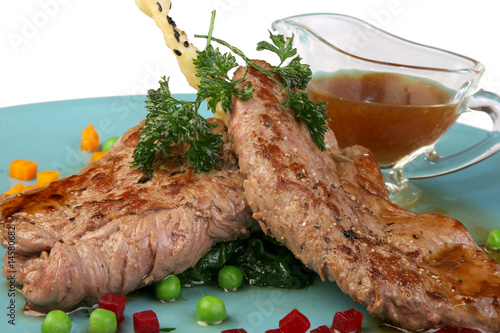 Photography Veal Medallions with Zucchini and Cherry Tomato