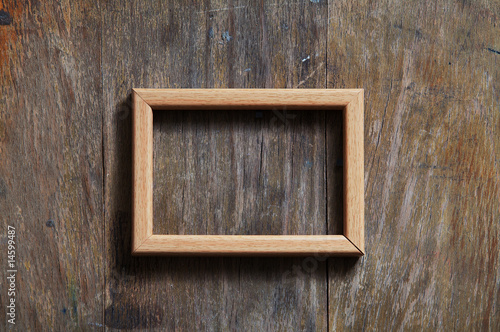 empty frame on wooden background