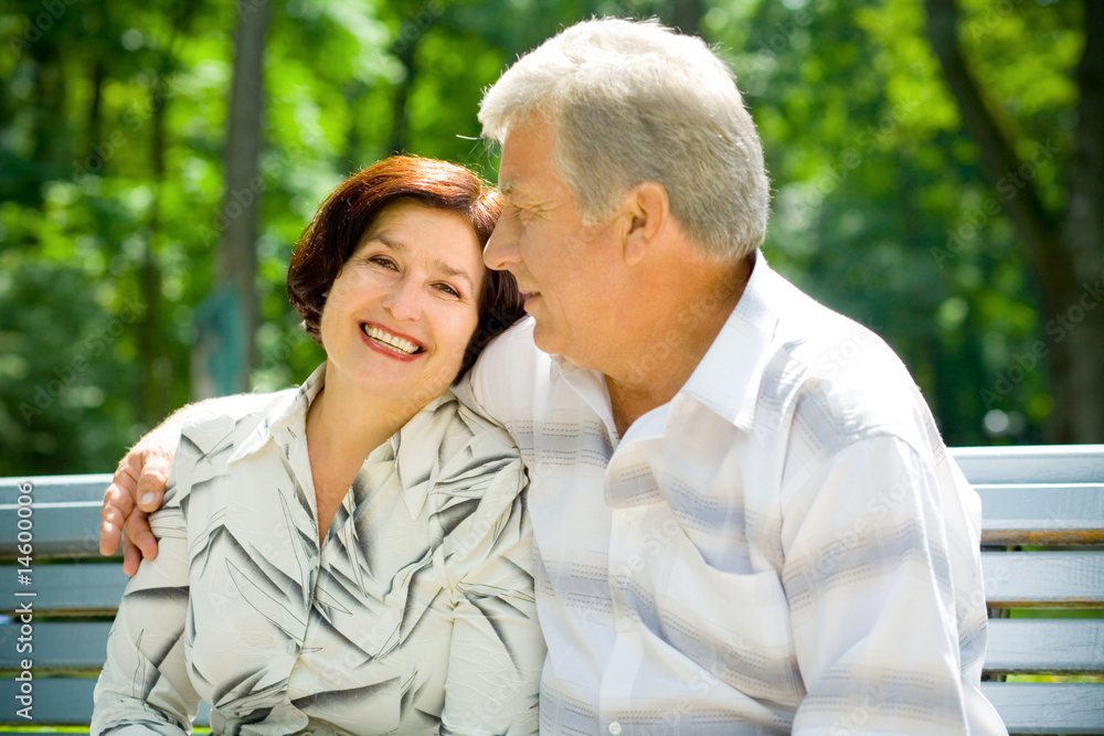 Attractive happy smiling senior couple embracing outdoors Attractive happy smiling senior couple embracing outdoors