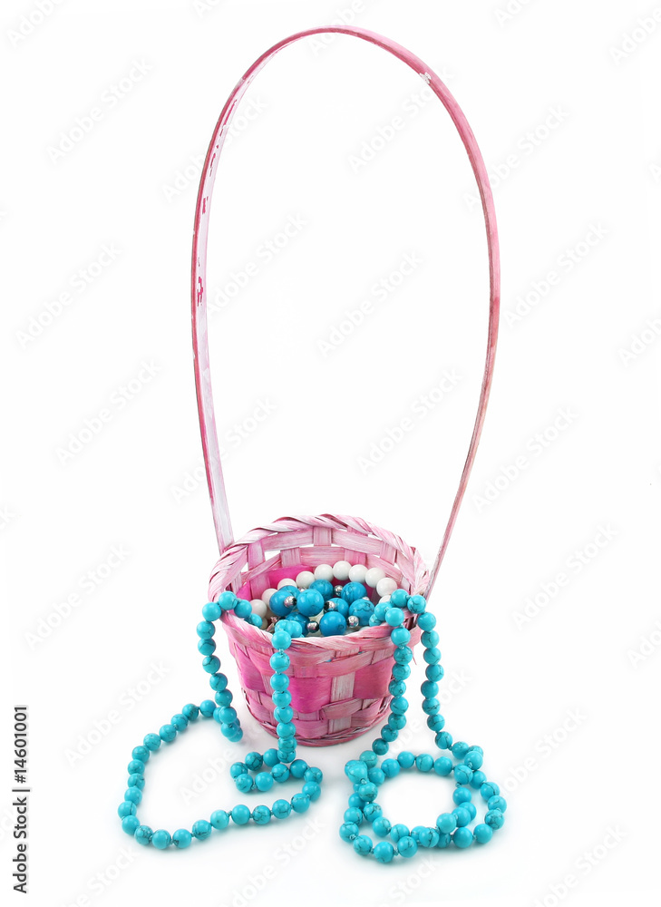 Colored Pearl Beads in Pink Wicker Basket Isolated Colored Pearl Beads in Pink Wicker Basket Isolated
