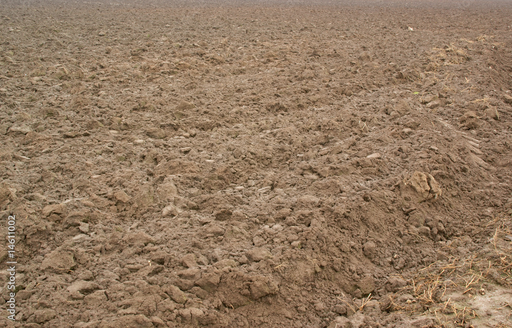 Brown soil, agricultural field background Brown soil, agricultural field background