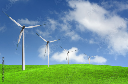 Beautiful green meadow with Wind turbines generating electricity