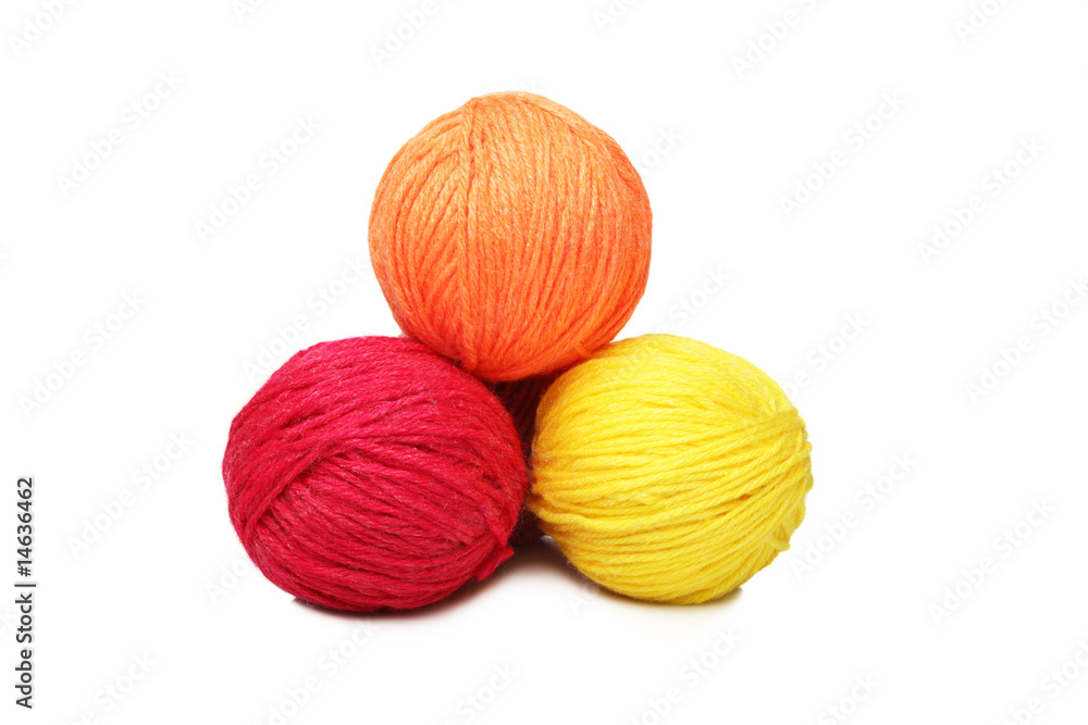 Colorful yarn balls over white Colorful yarn balls over white
