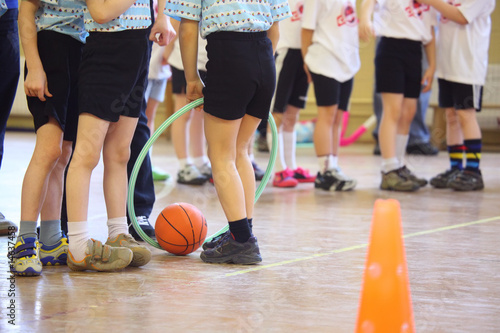 Children's feet in sports hall photo