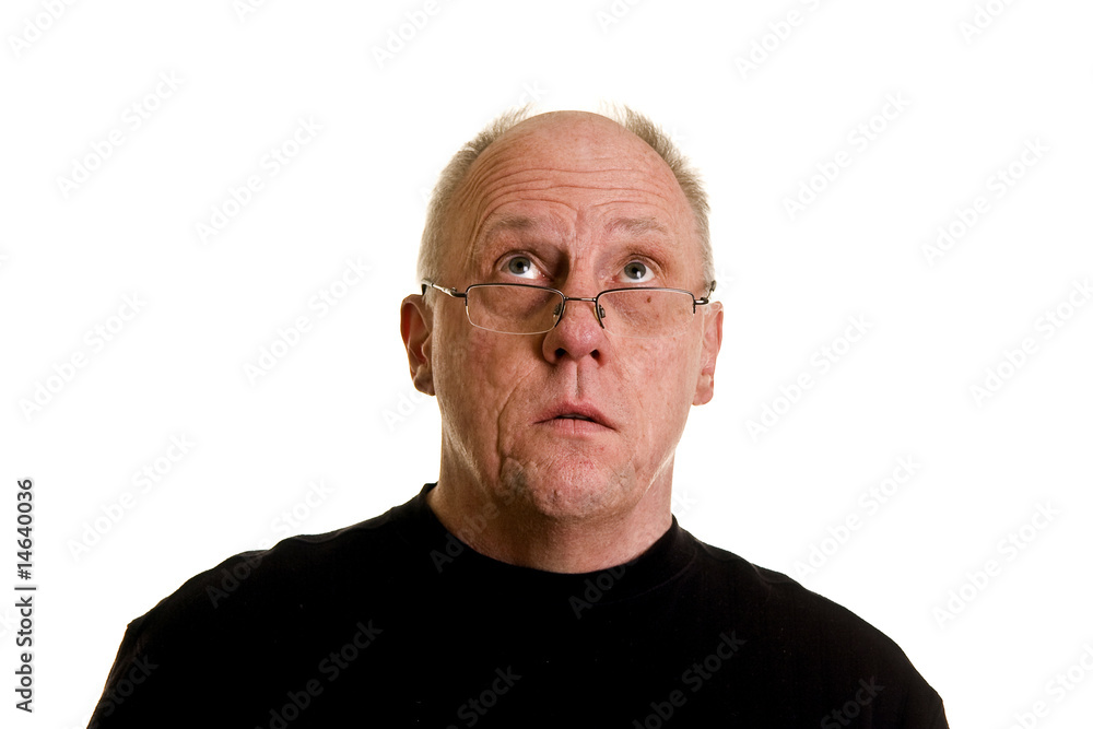 Older Bald Guy in Black Shirt Looking Up Older Bald Guy in Black Shirt Looking Up