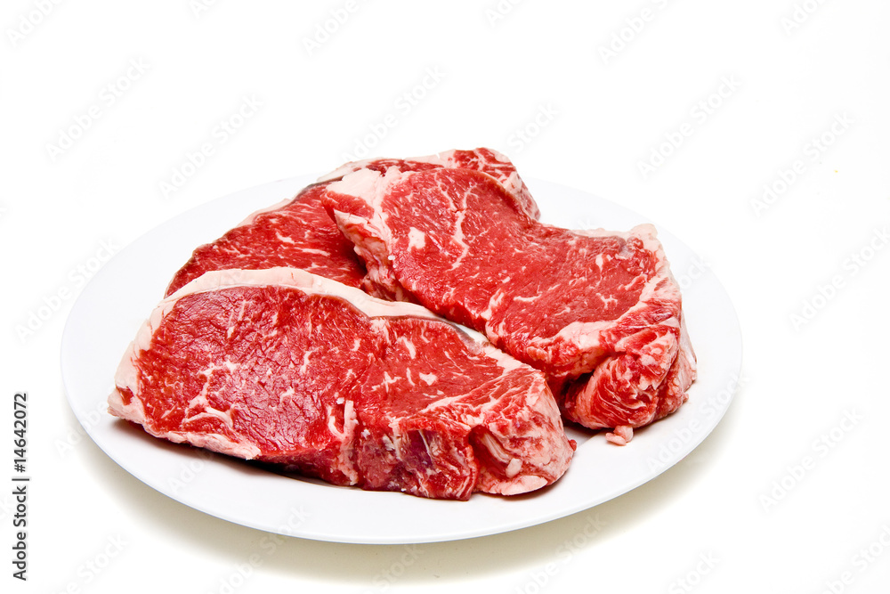 Prime Strip Steaks on Plate