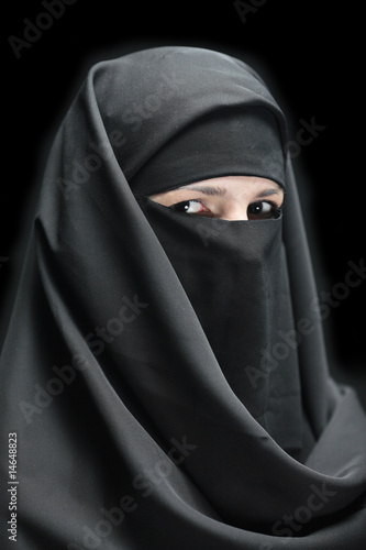 Photography A veiled woman isolated on a black background