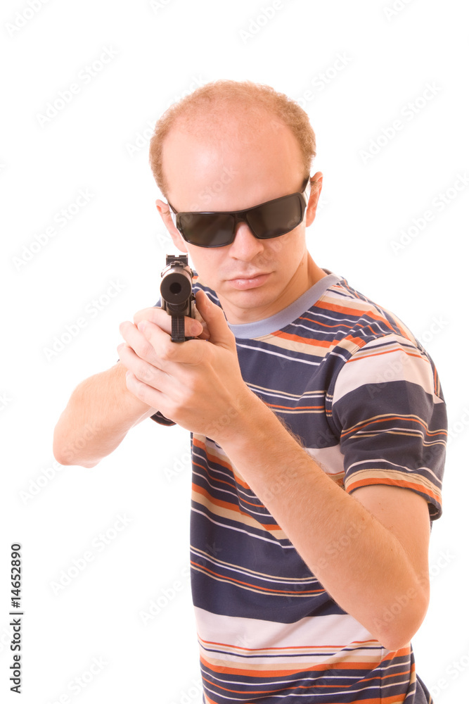 Young man with gun isolated Young man with gun isolated