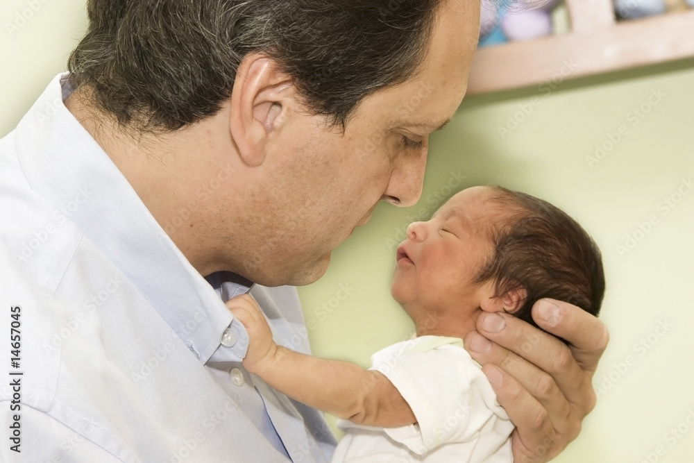 Fototapeta premium Father and Newborn baby