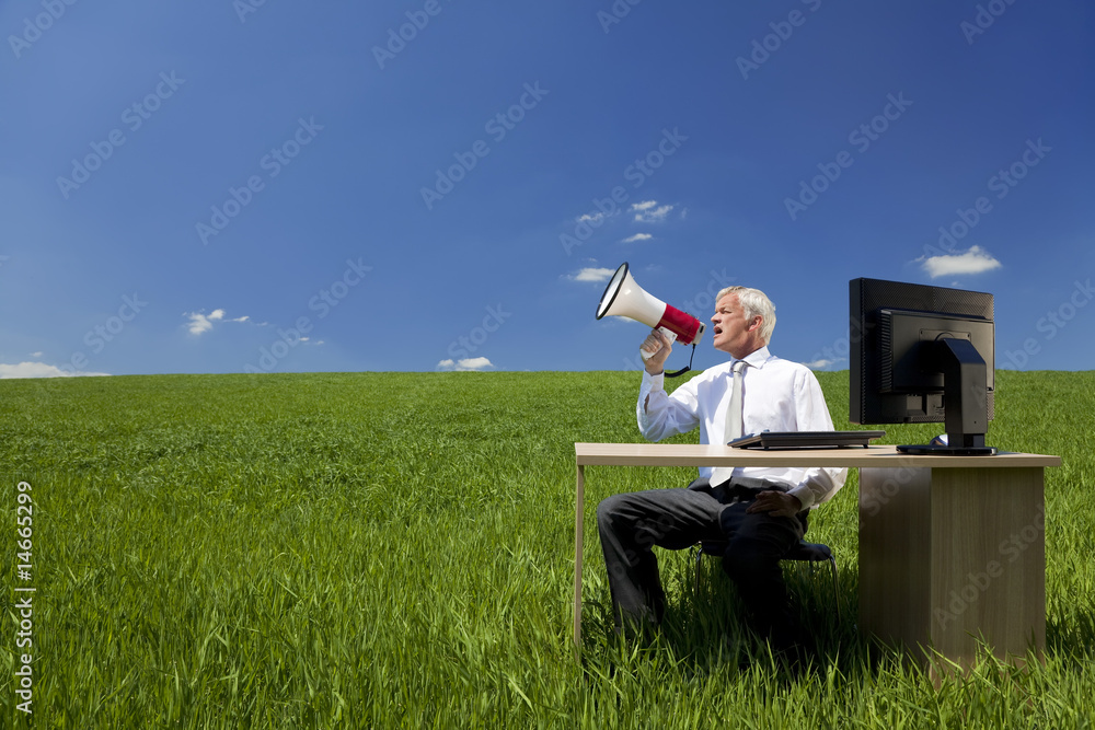 Business Concept Man Using Megaphone In A Green Field Business Concept Man Using Megaphone In A Green Field