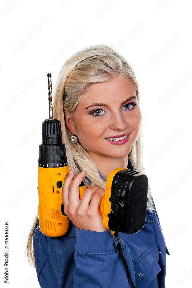 Frau in blauer Arbeits Kleidung mit Bohrmaschine Frau in blauer Arbeits Kleidung mit Bohrmaschine