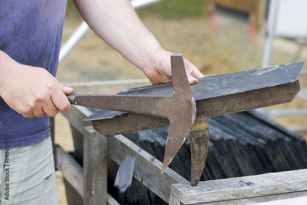 roofer cut a slate on a stack roofer cut a slate on a stack