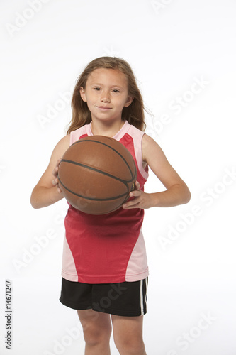 Little girl holding basketball