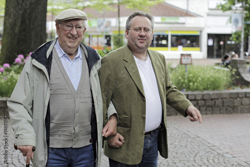 Grandpa and grandchild going through the city