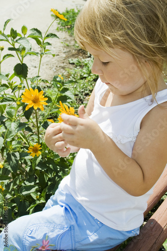 Girl holds flower