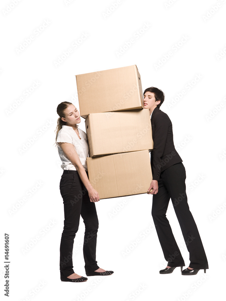 Two women carrying three boxes Two women carrying three boxes