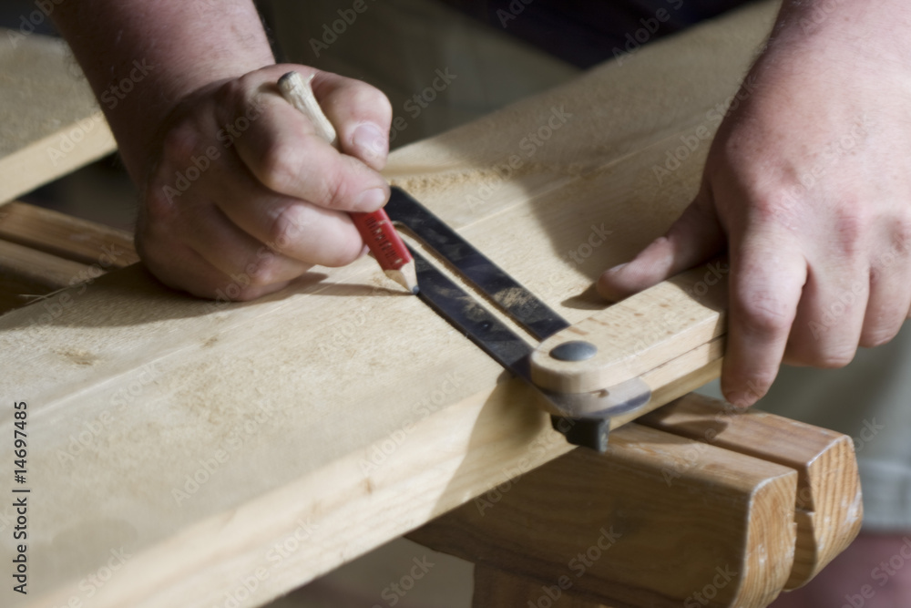worker drawing on wood plank worker drawing on wood plank
