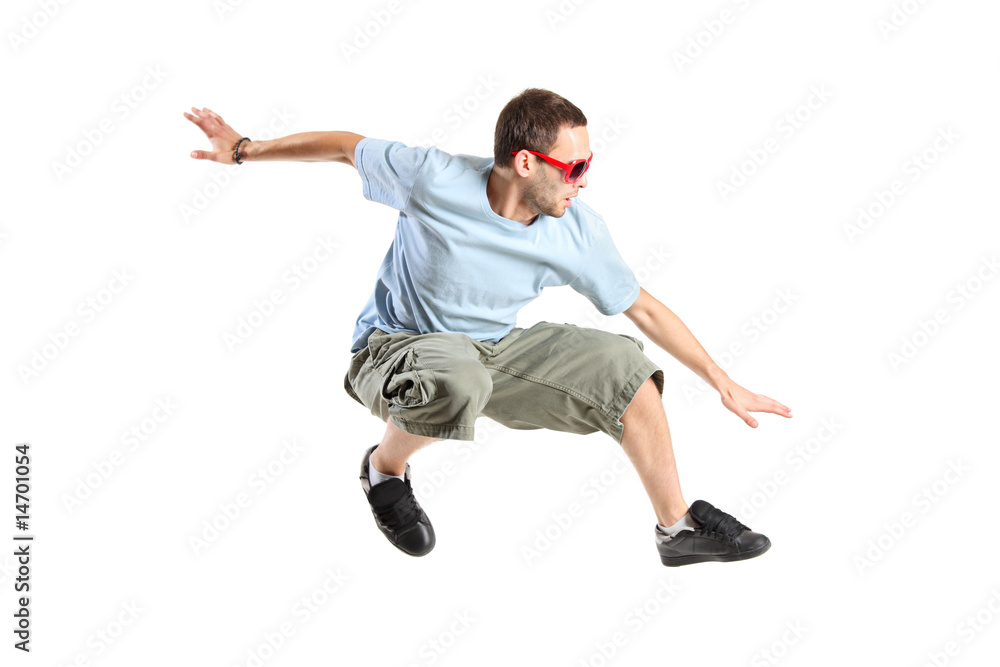 Fototapeta premium An attractive young man jumping in the air