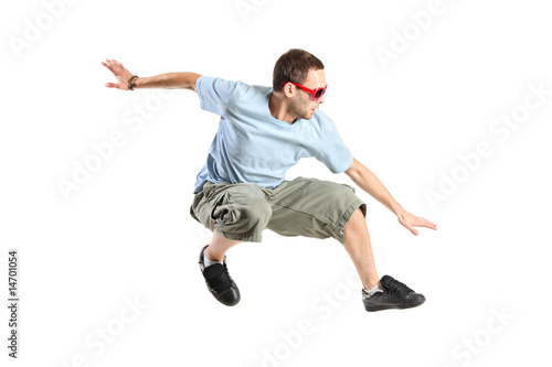 An attractive young man jumping in the air