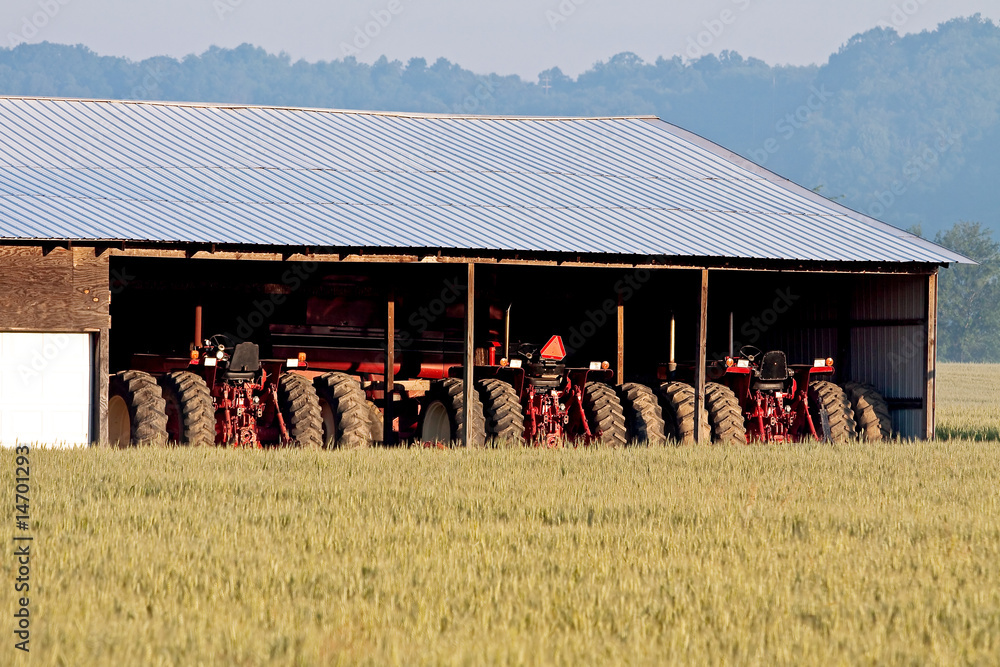 Fototapeta premium Parked Tractors and Wheat Field