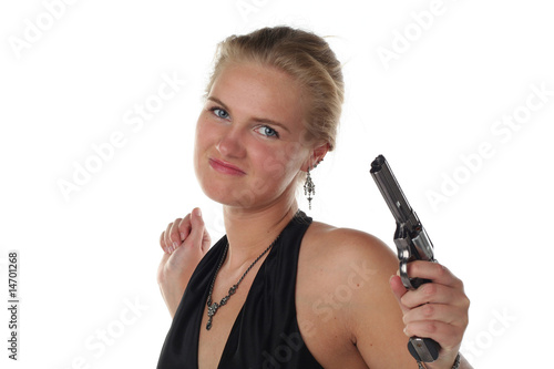 young blond woman in black dress with revolver