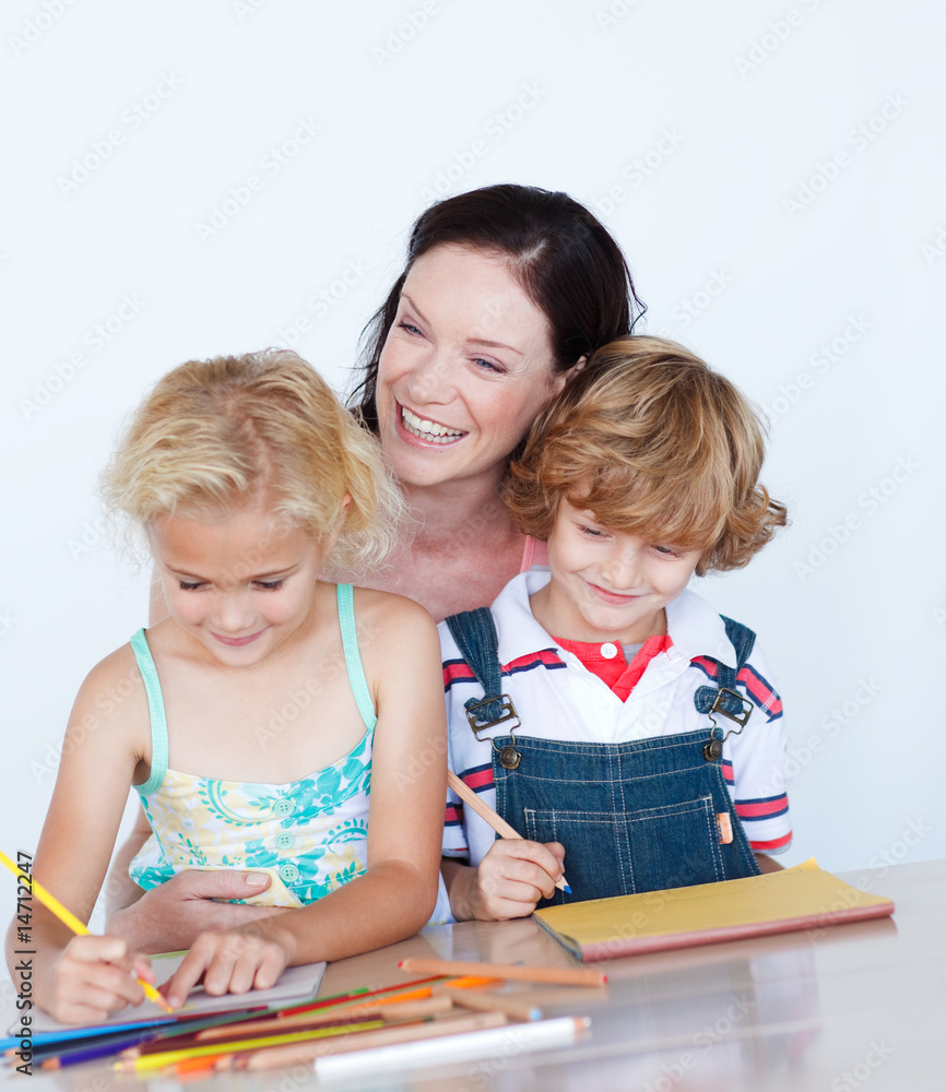 Children doing homework with their mother Children doing homework with their mother