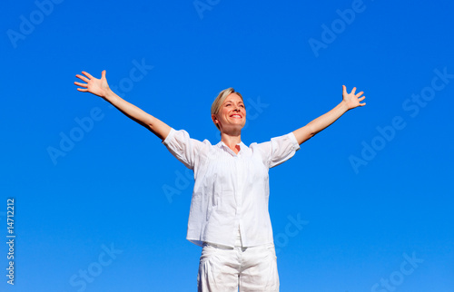 Happy woman feeling free with open arms © WavebreakMediaMicro