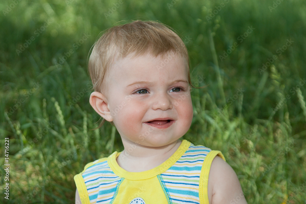 The baby on a grass The baby on a grass