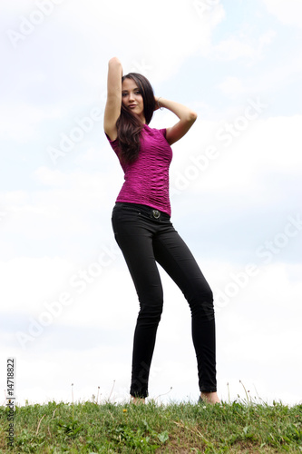 young woman on a background of the blue sky © Andrey_Arkusha
