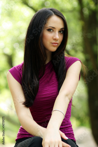 Portrait beautiful girl on a background of a summer garden