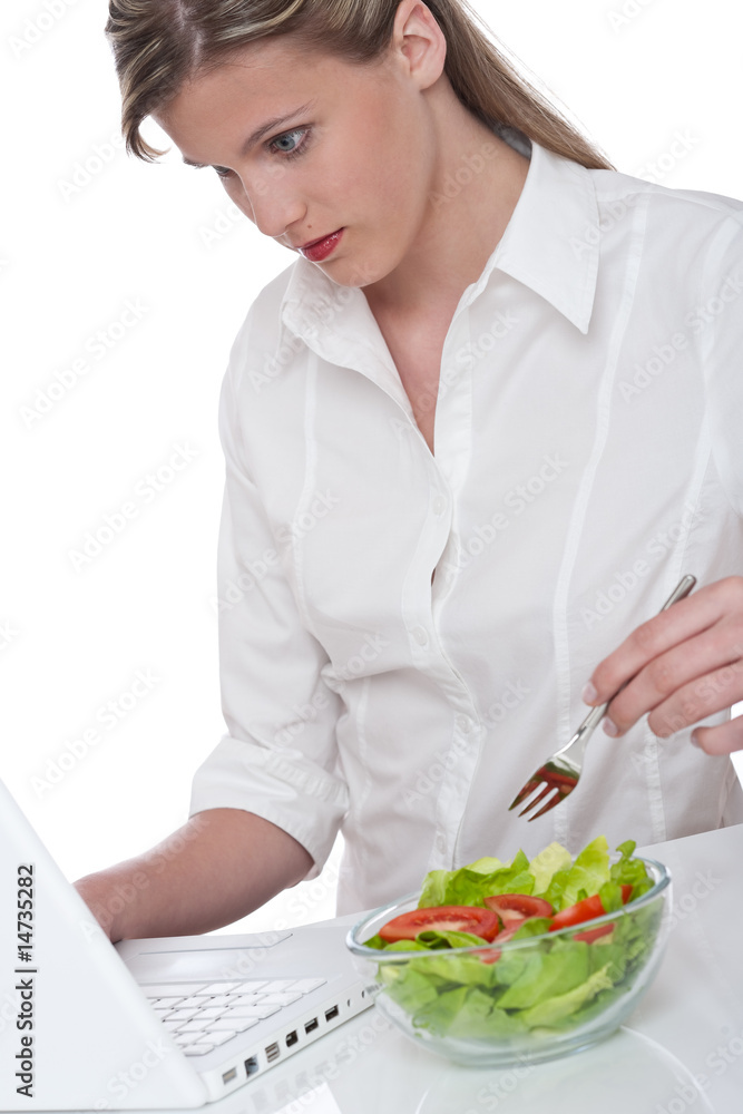 Healthy lifestyle series - Woman with laptop and bowl of salad Healthy lifestyle series - Woman with laptop and bowl of salad