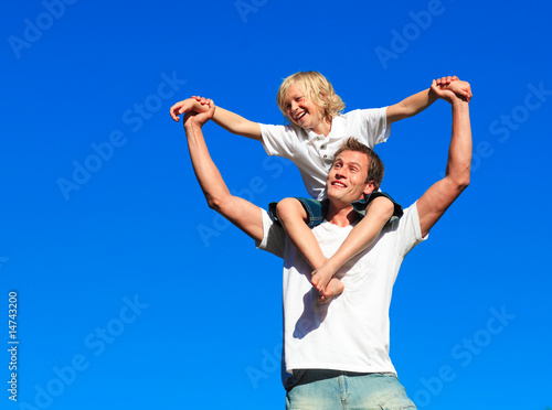 Boy giving kid a piggyback ride