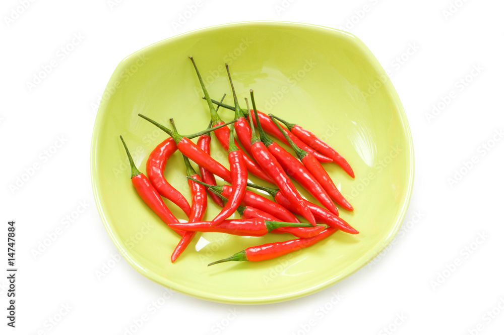 Peppers in plate isolated on the white