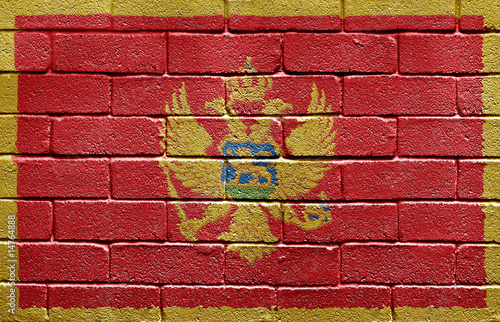 Flag of Montenegro on brick wall