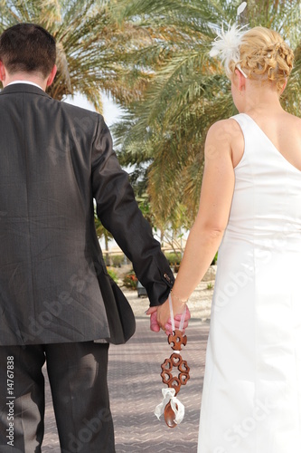 Newly weds walking in a park photo