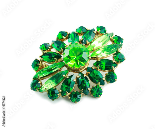 A green brooch isolated