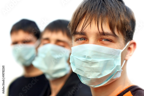three teenagers in the flu mask