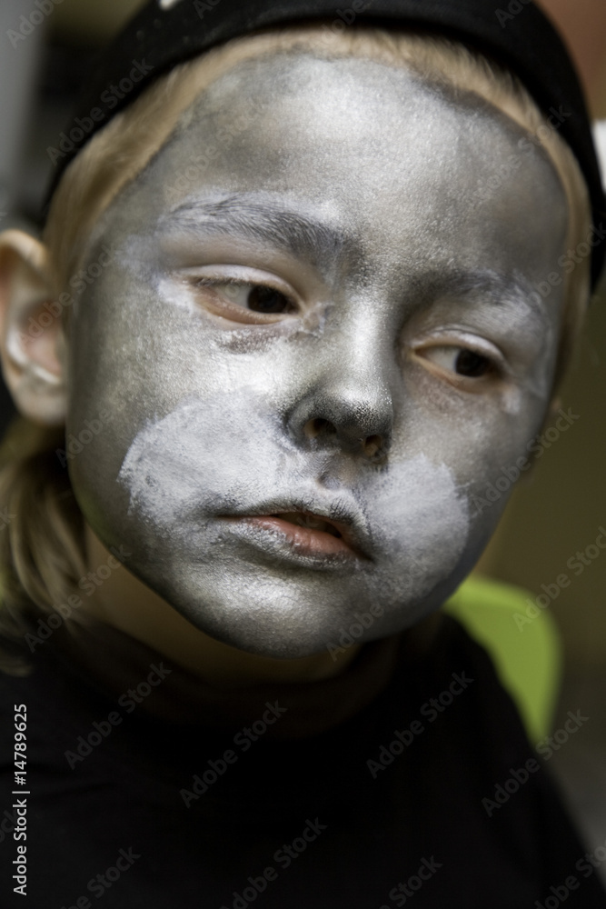 The boy makes a children's make-up The boy makes a children's make-up