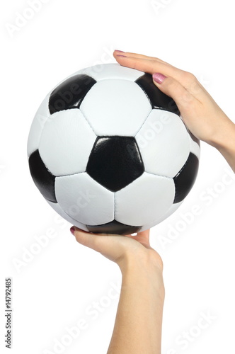 black and white Soccer ball in hands on a white background