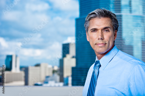 Confident Grey-Haired Senior Executive in A Downtown City Settin