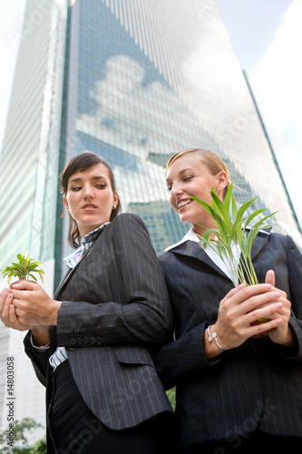 Billede på lærred Businesswomen with Plants