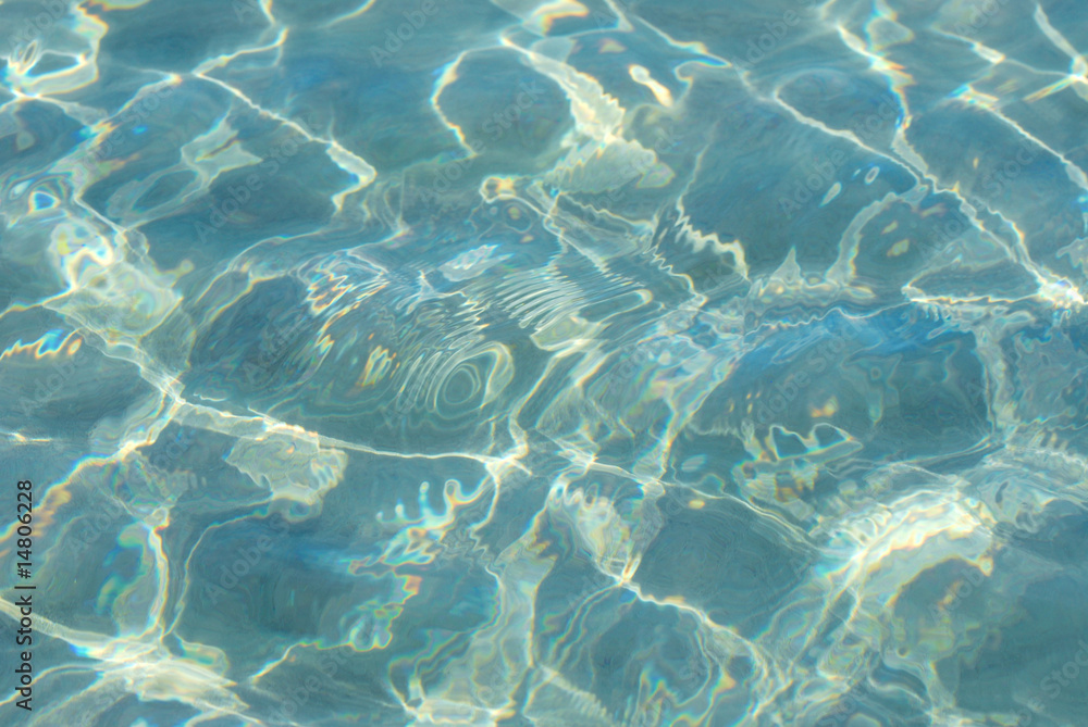 The Sun reflected in the beach water