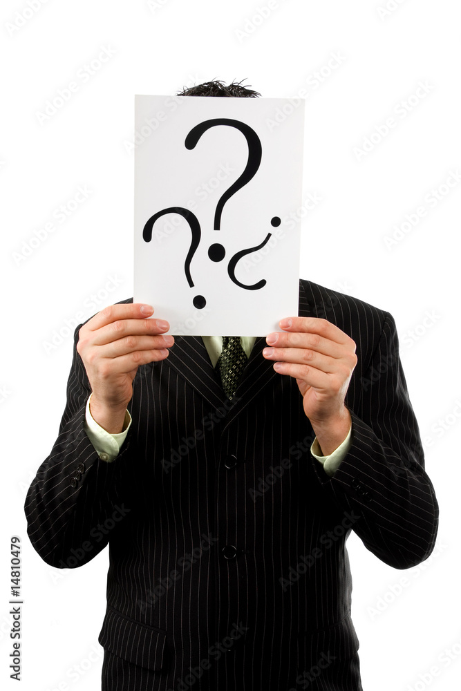 Businessman is holding a question mark Businessman is holding a question mark
