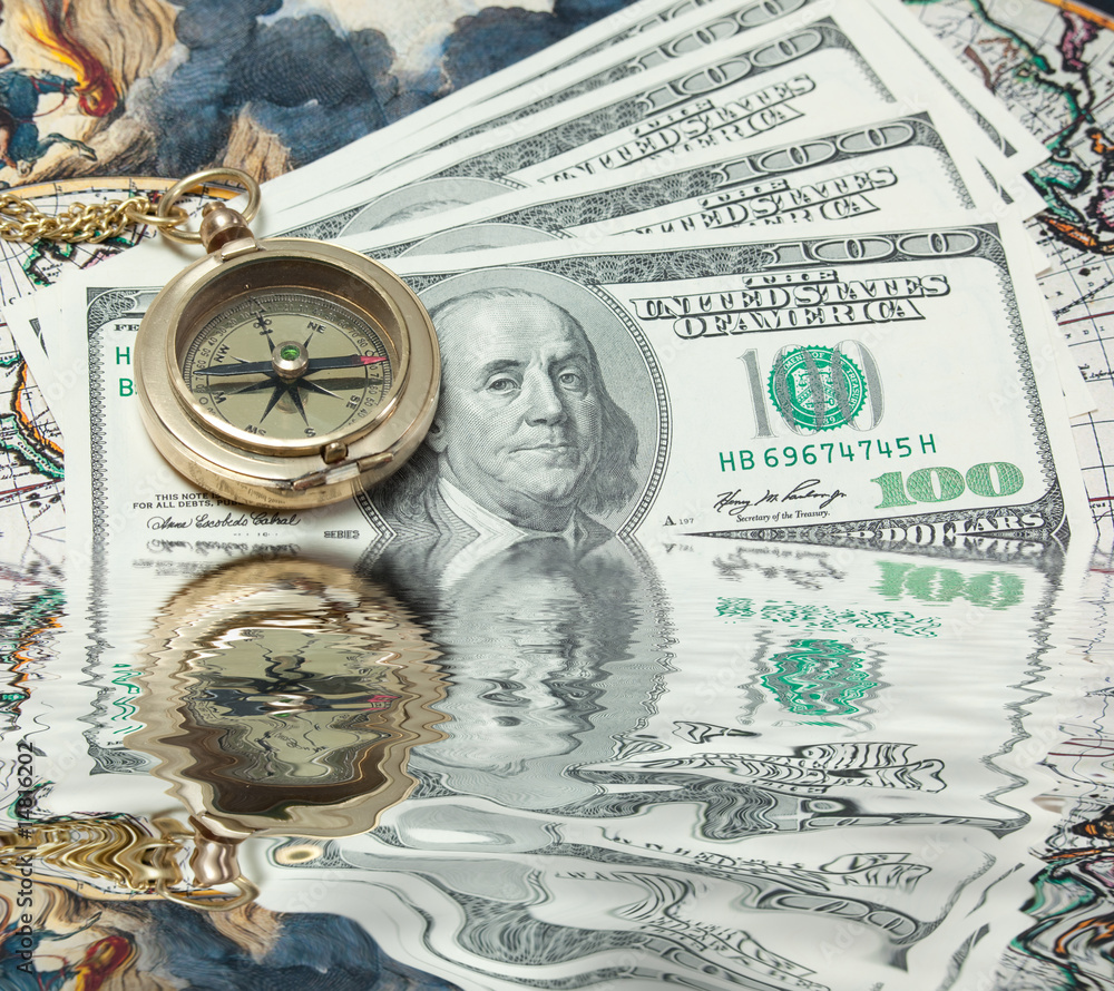 Time and money concept image - pocket watch and US currency isol Time and money concept image - pocket watch and US currency isol