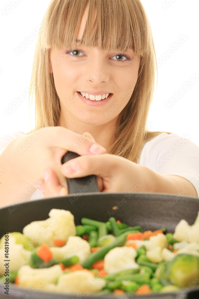 Young woman cooking food Young woman cooking food