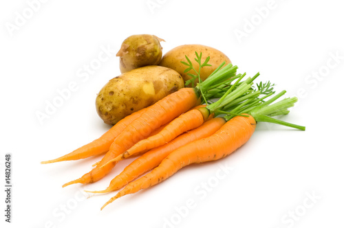 young potatoes and carrots on white background