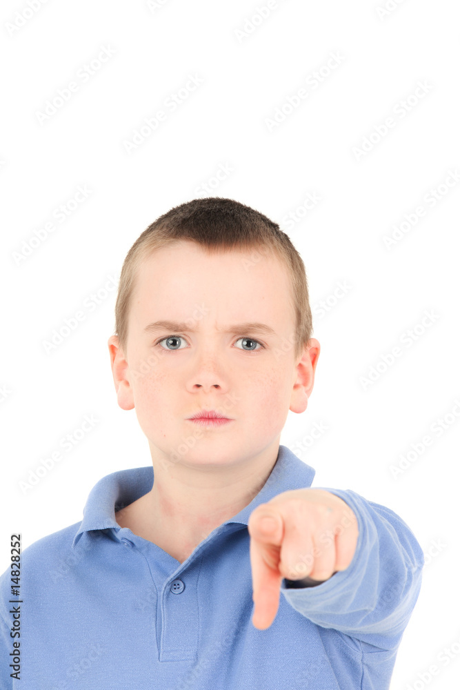 Portrait of young boy pointing finger, studio shot Portrait of young boy pointing finger, studio shot