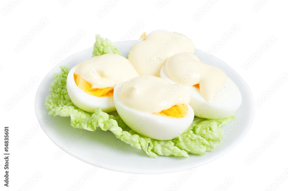 Eggs with mayonnaise on green lettuce leaf Eggs with mayonnaise on green lettuce leaf