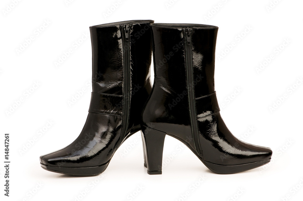 Black boots isolated on the white background Black boots isolated on the white background
